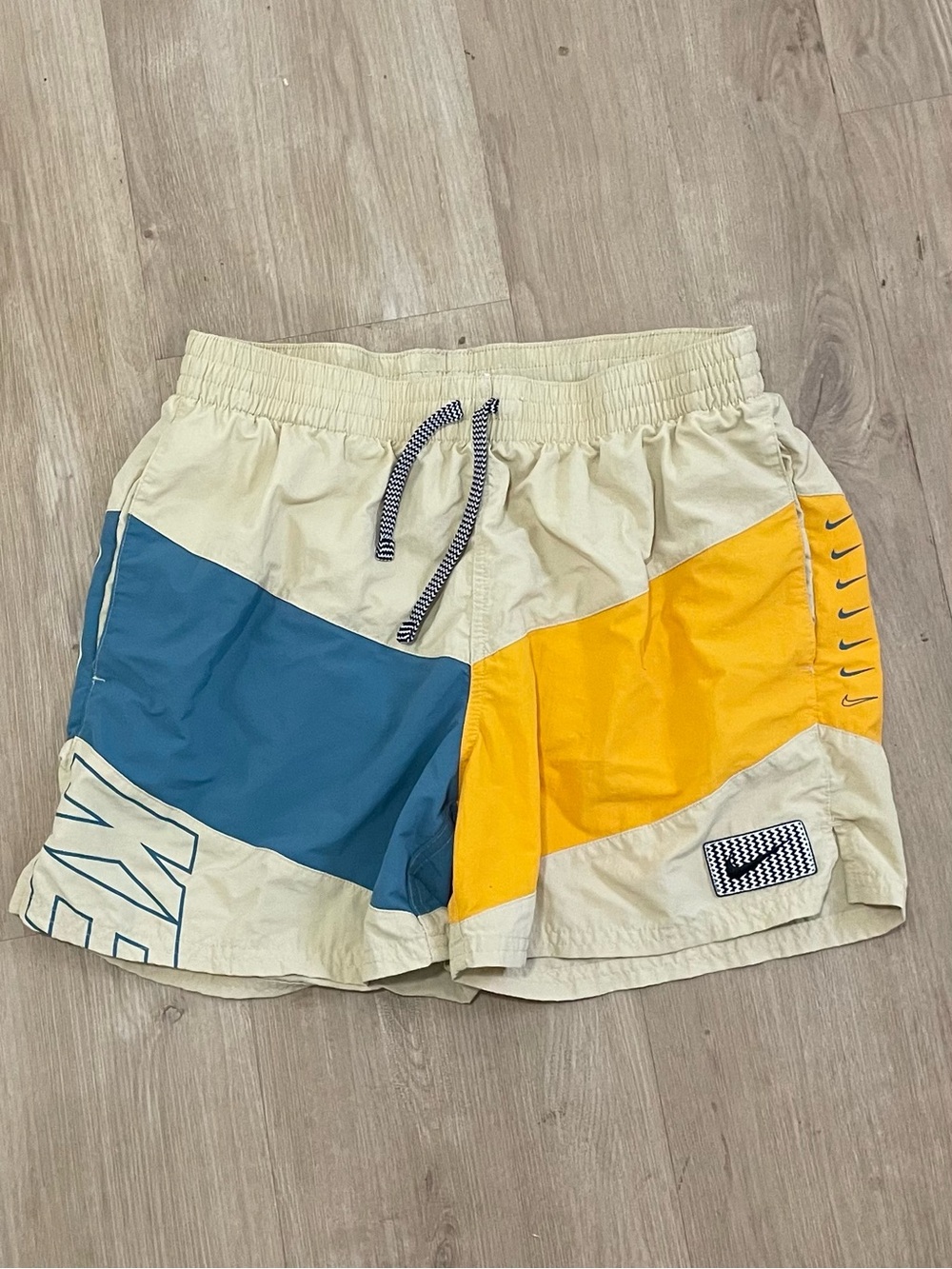 Nike Men’s Beige Swim Shorts with Yellow and Teal Panels